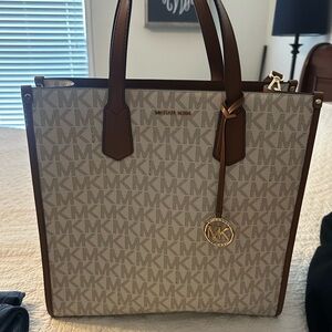 Michael Kors Cream and Brown Tote Bag with Monogram Pattern and Structured Shape